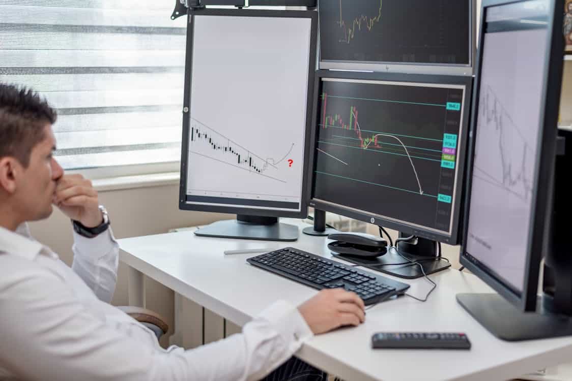 analyst reviewing financial data on computer